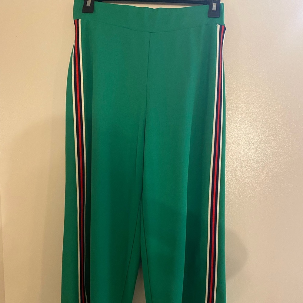 Over the knee high thick green pants with red/black/white stripes on sides
